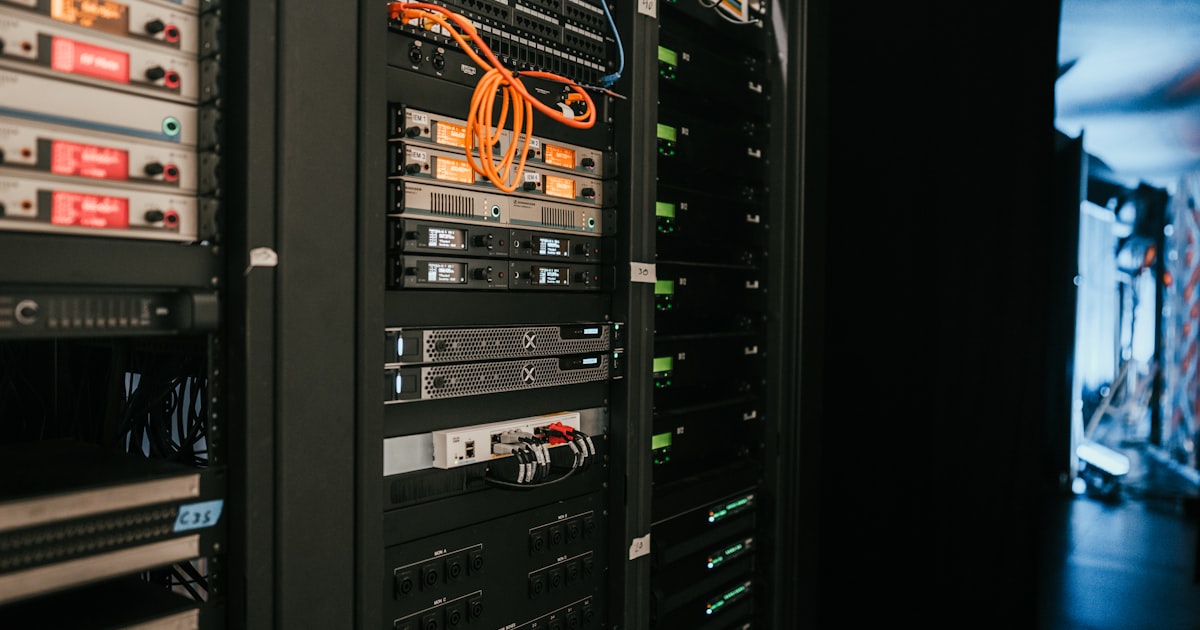 Server room with racks of networking equipment representing automated bot traffic sources